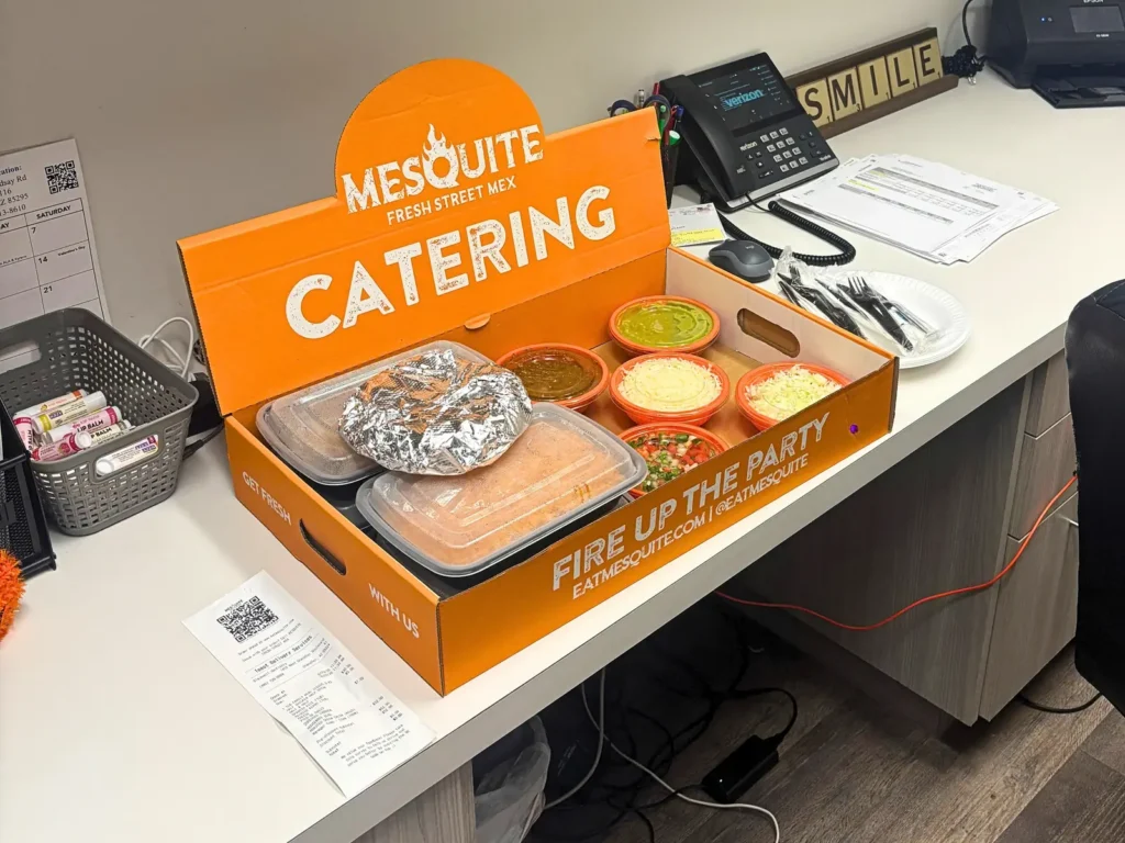A Mesquite catering box delivered to an office desk