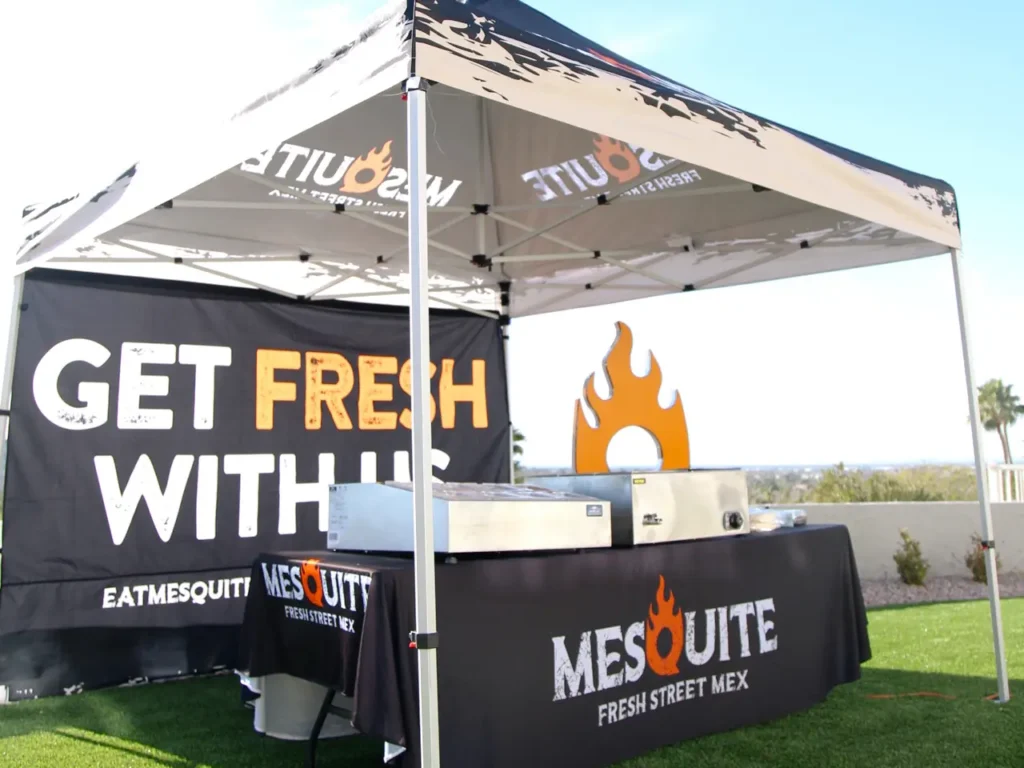 Mesquite Fresh Street Mex catering tent set up on the lawn at an outdoor event