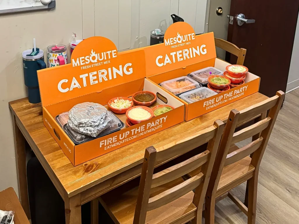 Two Mesquite catering boxes set up on a break room table