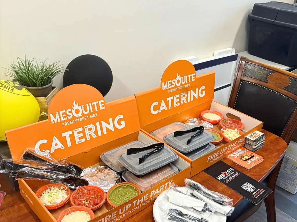 Mesquite taco bar catering with guac, salsa, cheese and toppings ready to serve